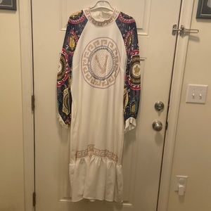 White dress/ long sleeves beaded work on dress never worn